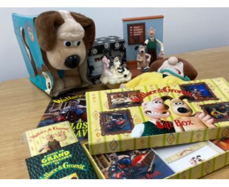 Wallace and Gromit collectors items to include a doorstop, novelty alarm clock, books &amp; soft toys etc
