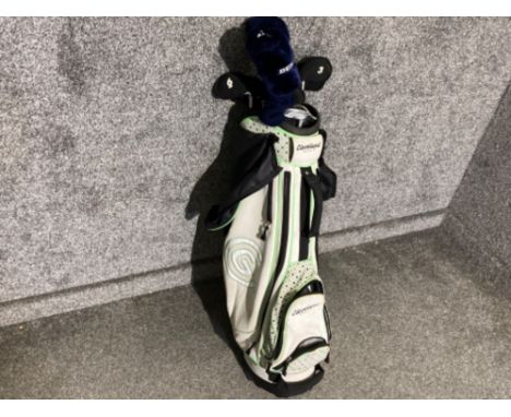 A set of Dunlop gold glubs including bag and covers