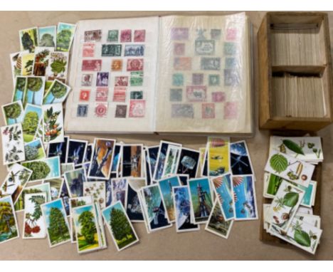 Album of miscellaneous stamps from around the world together with a vintage wooden case containing a large quantity of Brooke