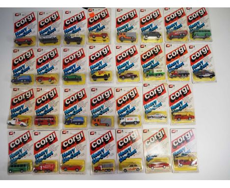 A group of CORGI JUNIORS USA issue carded diecast vehicles from the 'Heavy Diecast' series, mostly sealed as new, one fire en
