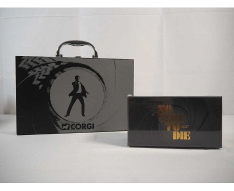 A group of CORGI James Bond related Aston Martins comprising a non-Corgi produced briefcase set with Corgi James Bond design 