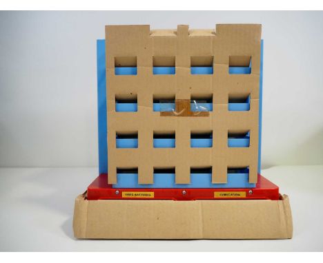An American produced battery operated plastic and metal car elevator parking garage, possibly circa 1970s/1980s (bought by th