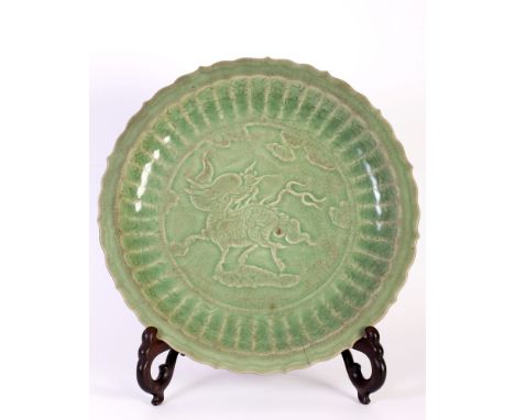 celadon porcelain charger, depicting kylin of foliate shape, the heavily potted, fluted sides ring from sturdy ring foot to t