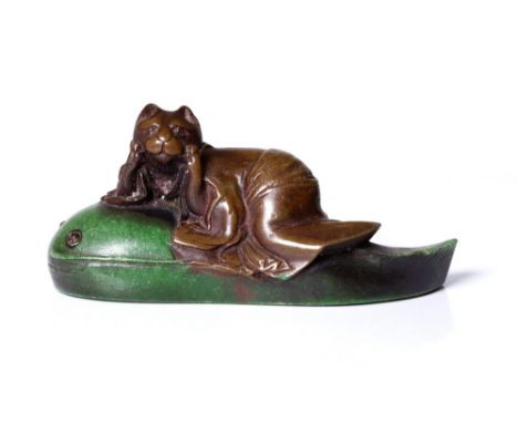antique, Japanese netsuke, depicting a cat riding a tadpole.  Early Showa.  This unusual, charming netsuke is executed from a