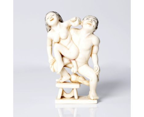 an antique, Japanese antler or bone, erotic netsuke.  Depicting a man and woman engaged in sexual intercourse. Very well made