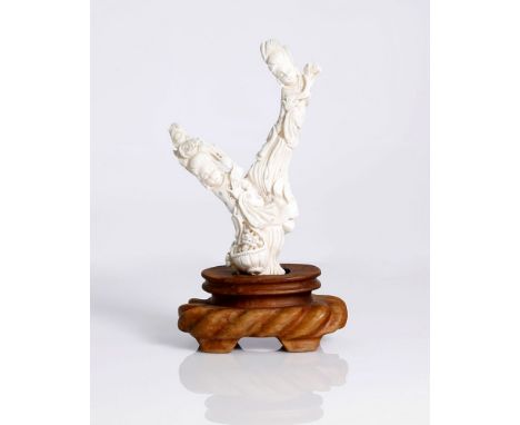 antique, Chinese lovely carved white coral, depicting 2 apsaras (celestial maidens). One is holding a basket of flowers , the