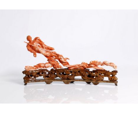 A fantastic, antique, Chinese, red coral, Apsara, flying in heaven with a ladle for holly water.  Beautifully carved, fine de