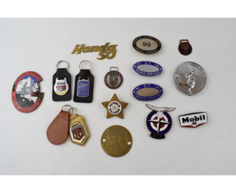 A collection of automobilia badges and similar items to include enamel Grossglockner Hochalpenstrasse badge, Lambretta tank b