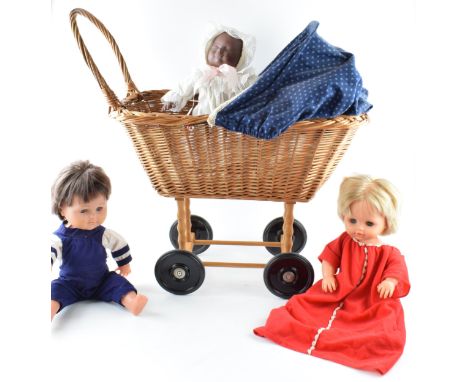 A vintage wicker childs pram with Tiny Tears and Tiny Tim dolls together with an additional doll (4)  