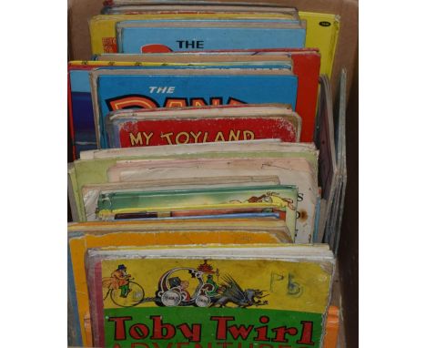 A quantity of vintage childrens annuals to include titles, Toby Twirl, The Dandy, Jolly and similar titles. (Approx 20)  In u