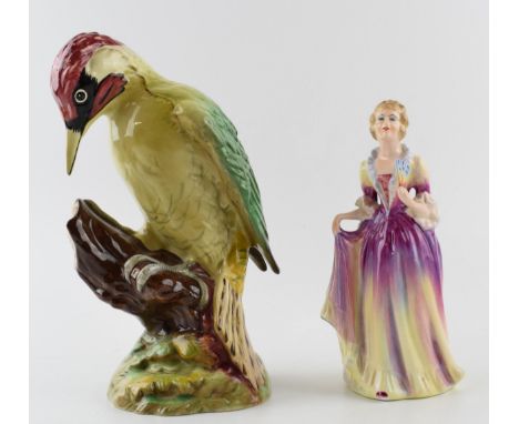 Beswick Woodpecker 1218, Height 23cm together a Gainsborough Figure by Adderley Floral.  In good condition with no signs of d