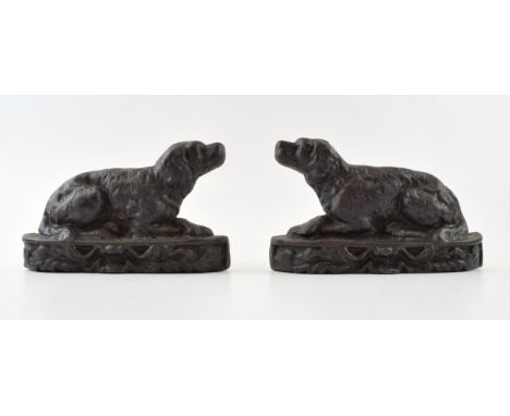 Pair of small antique dog door stops. English, cast iron decorative bookend or doorstopper in Retriever form, dating to the l