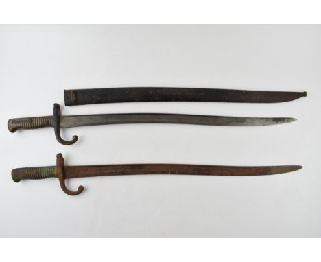 19th century French Chassepot bayonet in scabbard together with another similar example without scabbard.  Better example goo