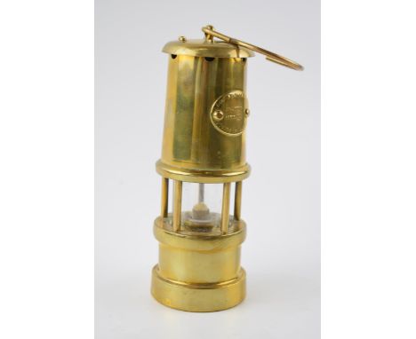 A brass vintage style miners safety lamp. Height 17cm.  In good condition.