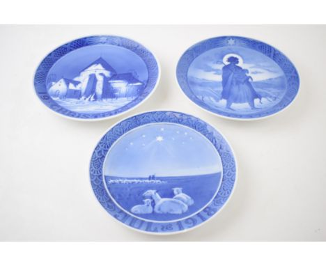 A trio of Royal Copenhagen Christmas plates to include 1957, 1918 (chipped) and 1938 (3).  2 are in good condition with no ob