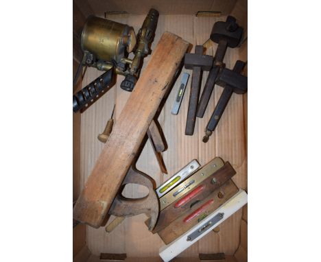 A collection of vintage tools to include a blowtorch, planes, marking gauges and others.  