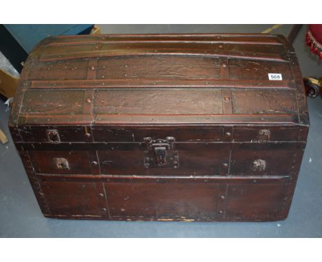 Antique domed top travelling trunk, lined with wall paper, 87cm x 55cm.  