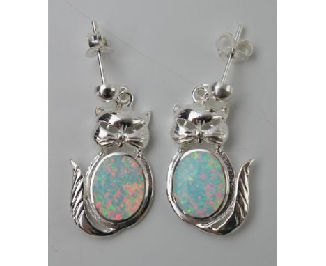 A pair of sterling silver earrings in the form of cats with opal style inserts (2).  