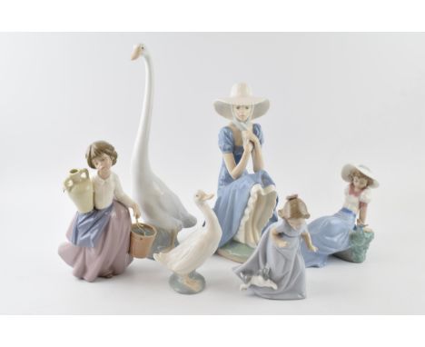 Nao by Lladro to include girl sitting with straw hat, a girl with a puppy, girl with a bird and a girl with a pot, a Nao larg