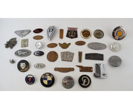 A quantity of vintage car and car club badges to include brass and chromed badges by manufactureres Ford, Fordson, Mercedes B