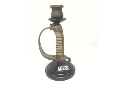 A converted sword grip in the form of a candle stick a British Navy offices sword with shagreen grip.