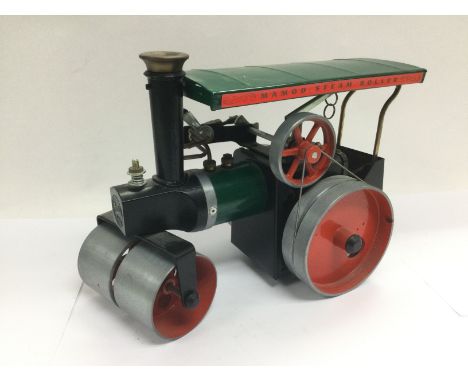 A Mamod steam roller with accessories. Shipping category D.