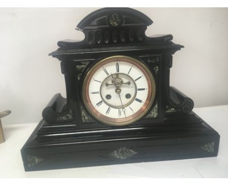 A large black slate and Marble mantel clock with visible escapement French movement Hight 40cm width 52cm