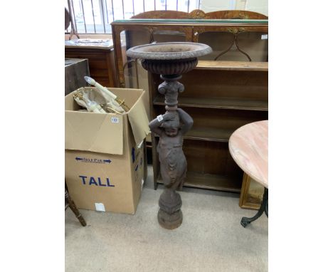 A cast iron garden statue in the form of a cherub planter. 110cm (D)