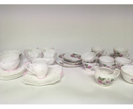 Two decorative English bone China tea sets Royal Vale decorated with roses and a pink poker dot Bell China tea set no obvious