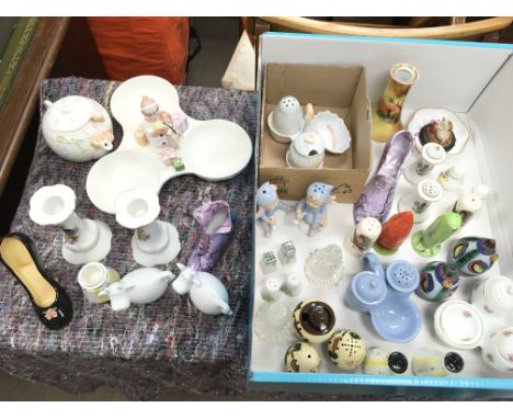 A collection of ceramics including Hummel, Edwardian salt and pepper sets. Postage cat D