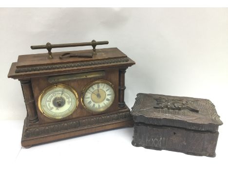 A mahogany cased clock and barometer set together with a carved oak box (2). Shipping category D.