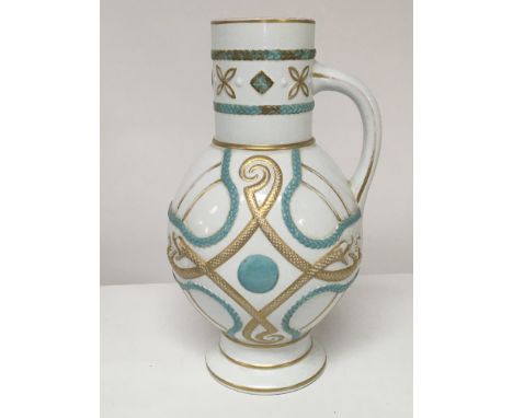 A Victorian Ceramic Aesthetic influence jug with raised turquoise blue and applied gilt decoration.date mark to the base no o