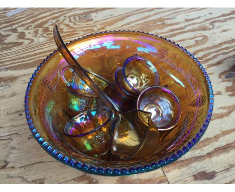 Two myth and magic figures and a carnival glass punch set.