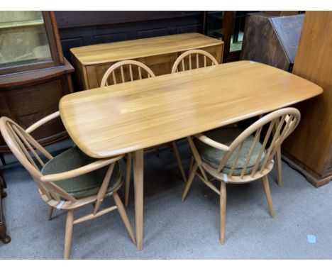 A vintage blonde Ercol elm plank topped dining table and 4 chairs (2 carvers/2 singles).