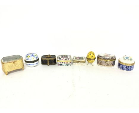 A group of small trinket boxes including ceramic Limoges egg, Meissen, oval box with cherub decoration, Egyptian styled box, 