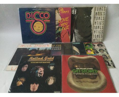 A collection of Rolling Stones and related LPs and a 12inch singles comprising a foreign pressing of 'Sticky Fingers', 'Some 