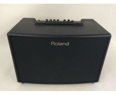 A Roland AC-90A acoustic chorus amplifier. Comes supplied with manual and amp cover.