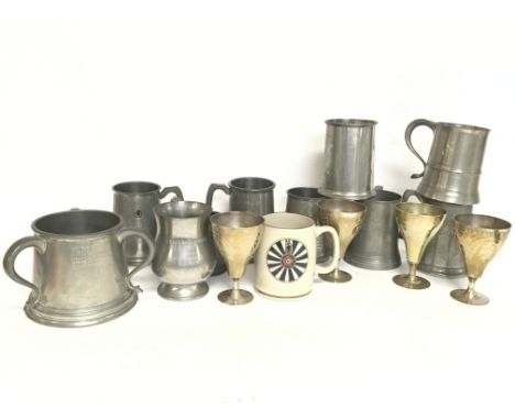 A collection of Pewter tankards, including a ceramic Grays pottery tankard