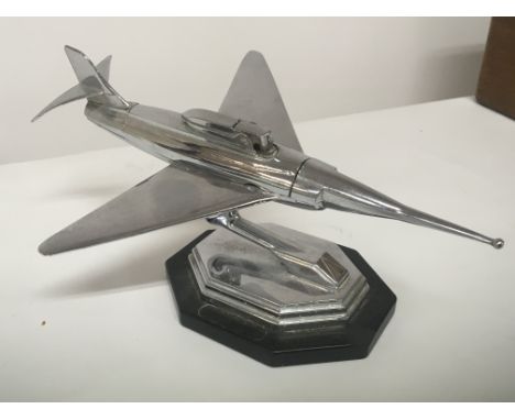 A Chrome mid 20th century design table lighter in the form of a Jet aeroplane.