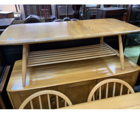 An Elm Ercol coffee table. 106cm 46cm x 34cm.