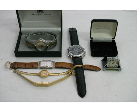 A small chrome travelling clock and a collection of other various watches including one boxed