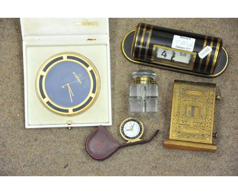 A boxed Eterna Swiss made paperweight clock, a cased miniature Weherle example, two vintage desk calendars and a glass inkwel