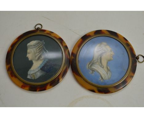 A pair of circular framed portrait miniatures indistincly signed Leionn (?) set in silver inlaid faux tortoiseshell framed 8c