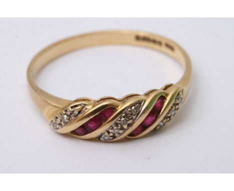 An 18ct gold ring inset with diamond and rubies