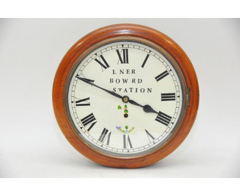 A mahogany wall clock, the circular dial marked LNER, Bow Road Station