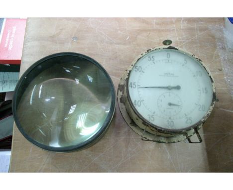 A Smiths clock and a large magnifier (2).