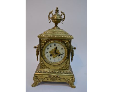 A French brass mantel clock in classical style, circular style with Arabic numerals