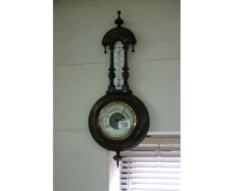 A mercury filled oak barometer.