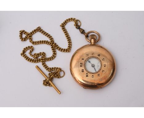 A 14ct gold half hunter pocket watch button wind with an enamel dial, the bak of the watch with personal inscription, with at