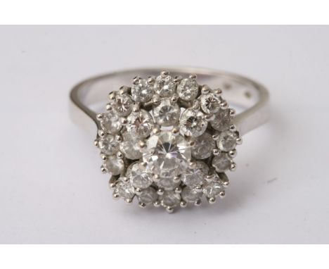 A white gold diamond cluster ring, approximate size V